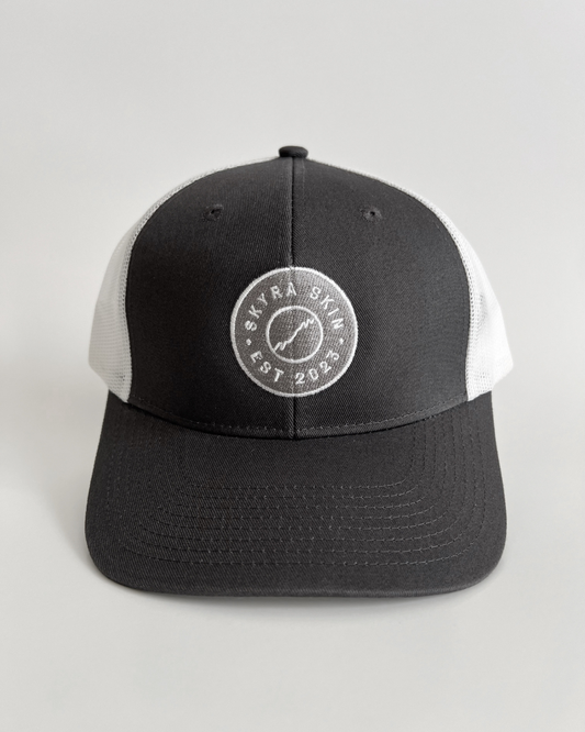 Skyra embroidered logo trucker hat front